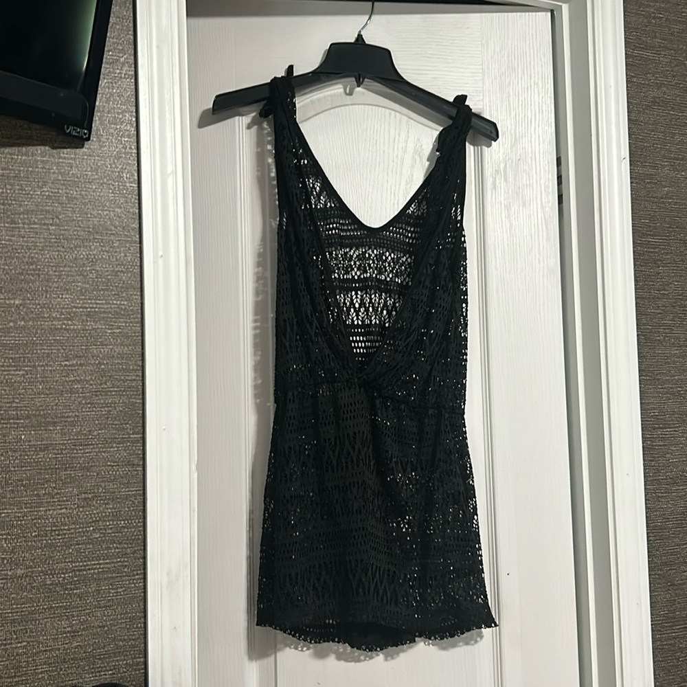 A bathing suit cover, black is the color of it